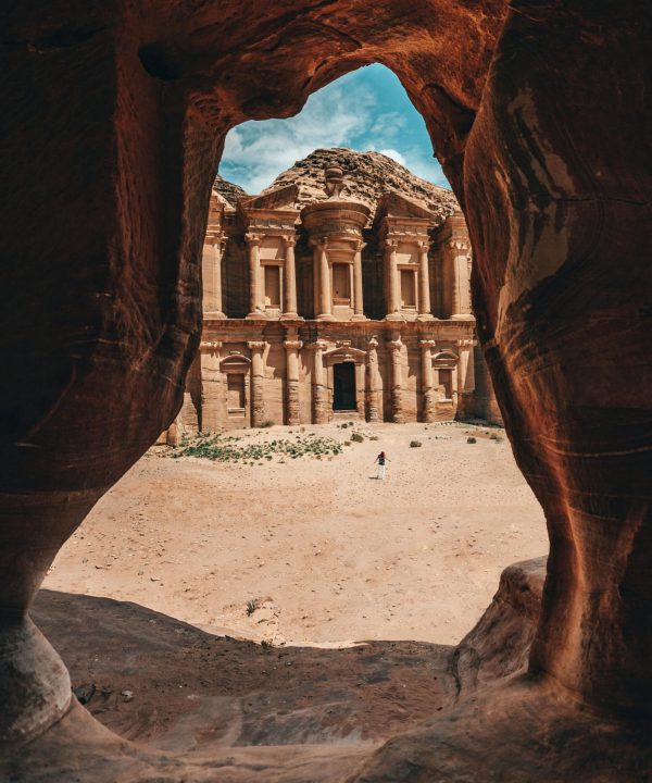 pexels-photo-4388167-4388167-1 Stunning view of Petra's Monastery framed by a natural cave in Jordan, showcasing ancient architecture.